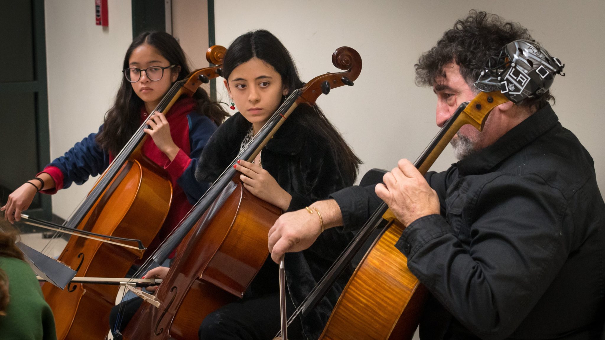students learning cello